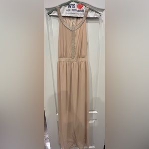 Long Champaign colored dress with sequenced design around the neck